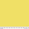 Solid yellow fabric swatch with ruler for scale.