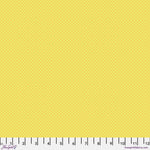 Solid yellow fabric swatch with ruler for scale.