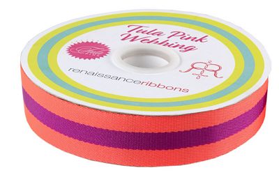 A roll of ribbon with two different colors.