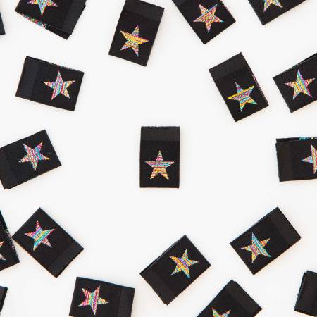 Scattered black cards with star symbols on a white surface.