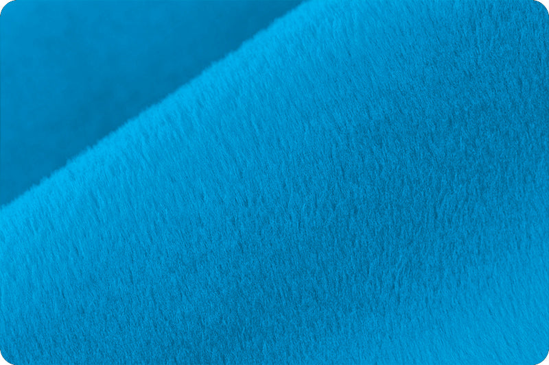 A close up of the blue fabric
