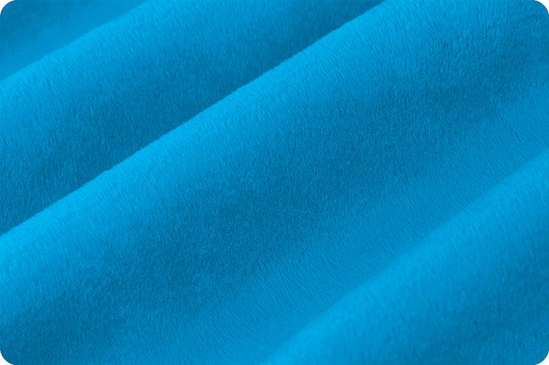 A close up of the blue fabric