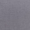 A gray fabric background with some white lines.