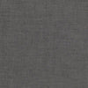 A gray fabric background with some white lines.