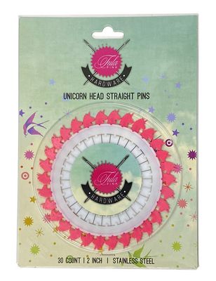 A pink and white circular pin with the words " unicorn head straight pins ".