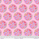 A pink background with many different colored flowers.