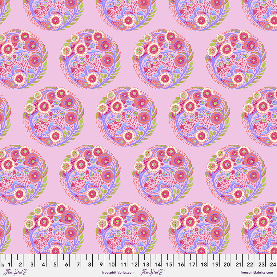 A pink background with many different colored flowers.