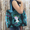 A woman holding onto a bag with a picture of a lady on it