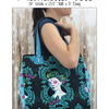 A woman holding onto a black bag with blue handles