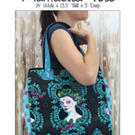 A woman holding onto a black bag with blue handles