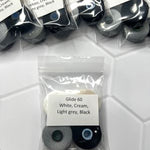 A bag of black and white contact lenses