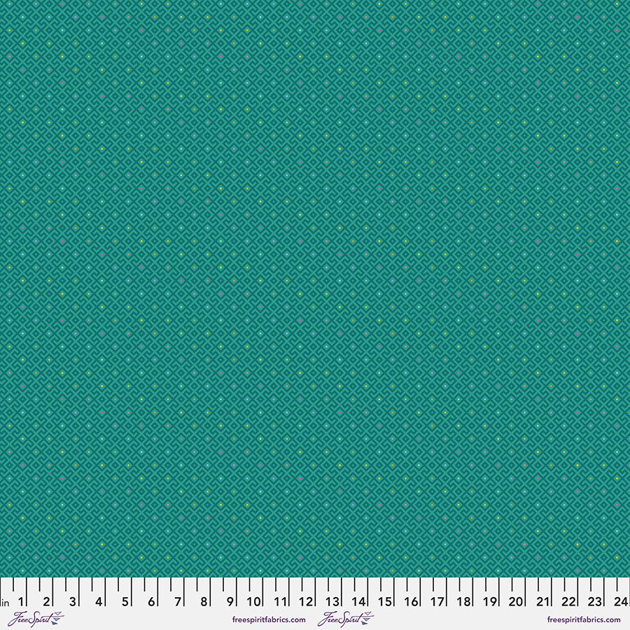 A green fabric with white dots on it