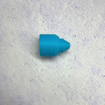 A blue piece of plastic sitting on top of a wall.