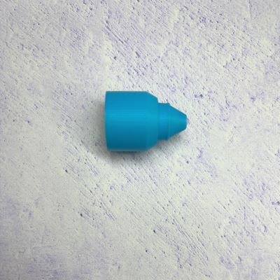 A blue piece of plastic sitting on top of a wall.