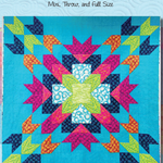 A quilt with colorful designs on it.