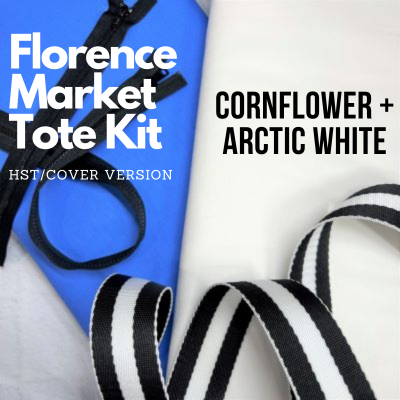 A black and white striped ribbon next to a blue bag.