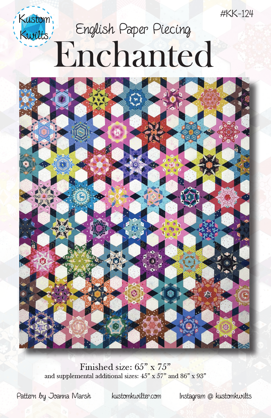 Colorful floral quilt with hexagonal patterns.