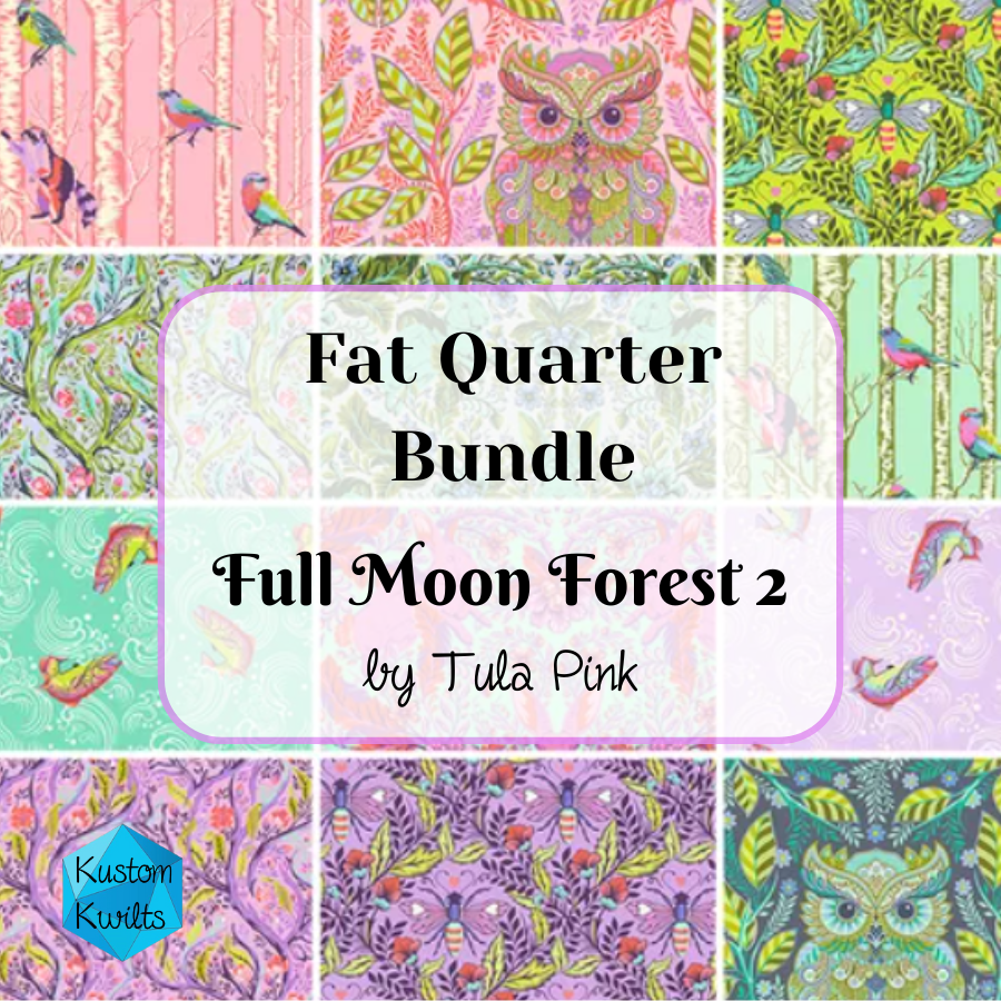 Colorful fabric bundle with floral and paisley patterns by Tula Pink.