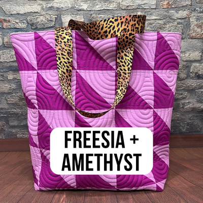 A bag with a leopard print handle and a purple pattern.