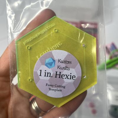 Yellow hexagonal skincare product labeled 'J in Hexie'.