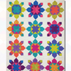 A quilt with different colored stars on it.
