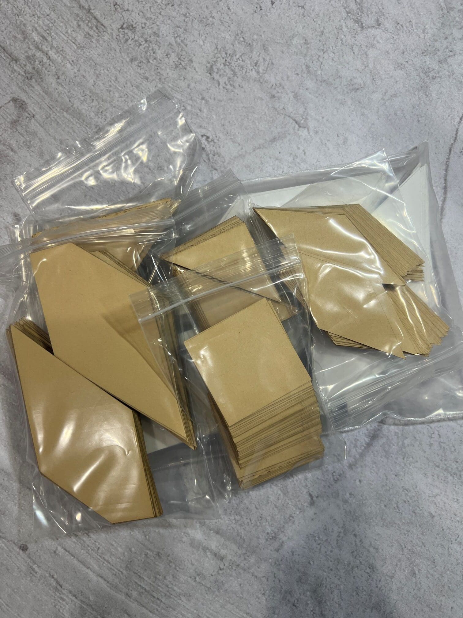 A bag of brown paper with some pieces cut out