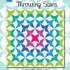 A colorful quilt with the words throwing stars.