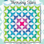 A colorful quilt with the words throwing stars.