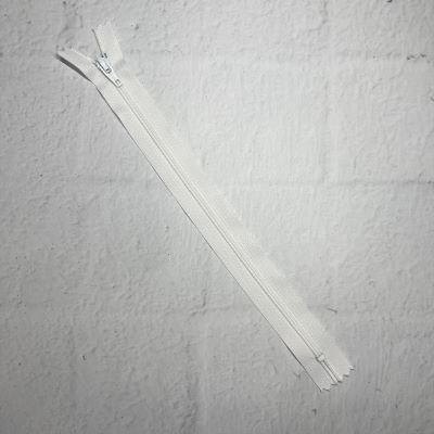 A white piece of fabric with two zippers.