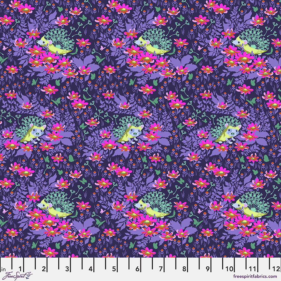A purple floral pattern with green leaves.