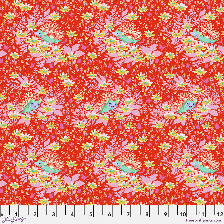 A red floral fabric with pink and yellow flowers.