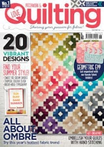 Quilting magazine cover with colorful patterns.
