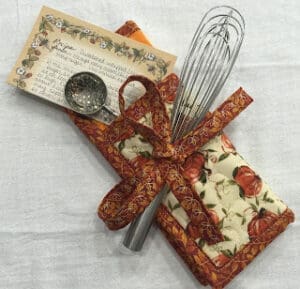 Recipe card with whisk and measuring spoon.