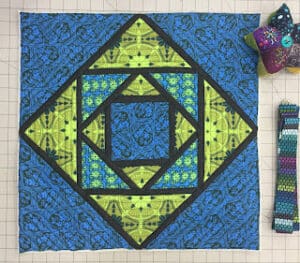 Geometric quilt pattern with vibrant colors.