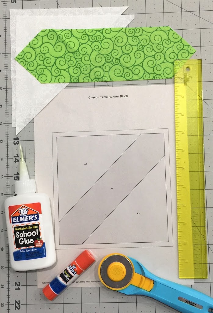 A piece of paper with some glue and a ruler