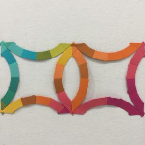 A colorful paper strip with a pattern of circles.