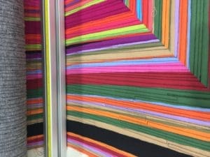 A close up of many different colored papers
