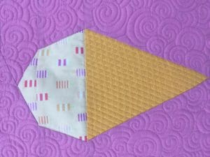 A close up of an ice cream cone quilt block.