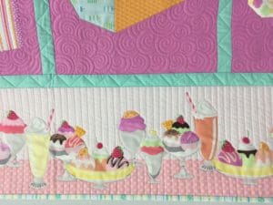 A close up of the ice cream parlor quilt