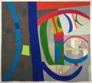 A painting of various colors and shapes on the wall.