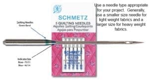 A package of five quilting needles on top of a card.
