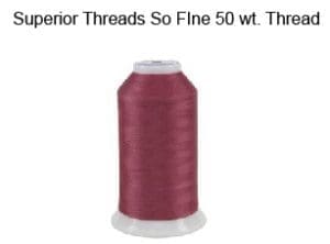 A spool of thread with the words " interior threads so fine 5 0 wt. Thread."