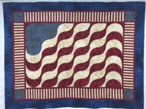 A quilt with an american flag on it.