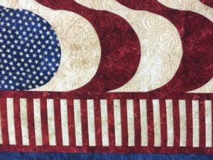 A close up of the american flag quilt