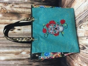 A bag with a skull and roses on it