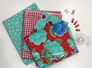 A table with some fabric and some clips