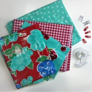 A table with some fabric and a sewing machine