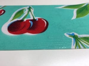 A close up of the cherries on a table