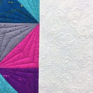 A close up of the quilt with white background