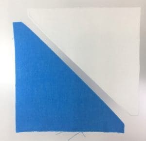 A piece of paper with blue and white papers on it.